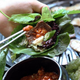hand holding lettuce wrap